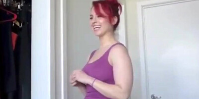 Muscled redhead MILF dances for the camera and gets naked