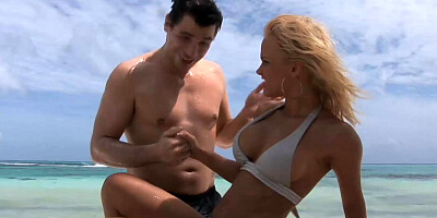 Blonde beauty with big tits gets fucked outdoors at the beach