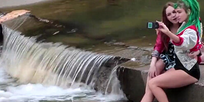 Two perverted lesbians are making out in the open air
