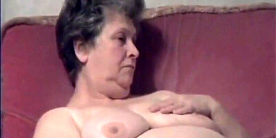 Slutty granny loves to masturbate and flash her big tits in public