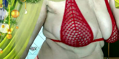 Another video recording of an online broadcast where a hot housewife in the kitchen puts on red lingerie to cheer up