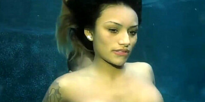 Classic sex video shows inked MILF having nice sex underwater