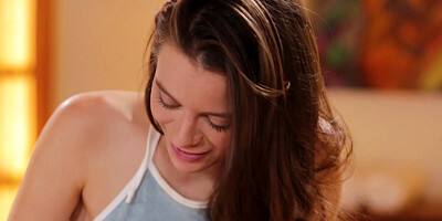 Brunette masseuse is giving a relaxing body rub to her blonde client before oral treatment