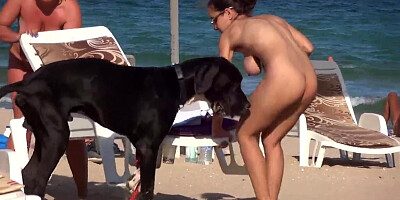 Male is interested in naked body of a housewife on beach