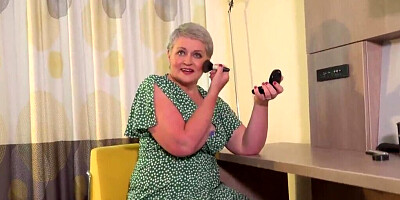 Mature woman in stockings puts fingers in her pussy