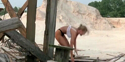 Romantic lovemaking scene between a busty blonde model Erika Eleniak and her partner