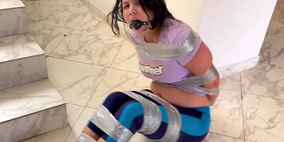 Ball Gagged Girl Struggle In Tape Bondage