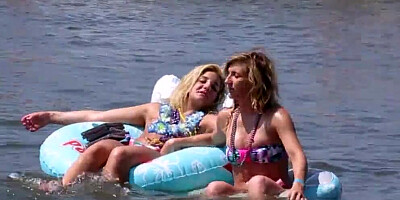 Camera caught a couple of topless babes while on their summer vacation