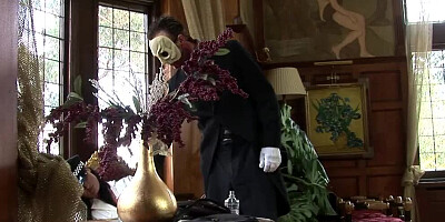 A brunette satisfies the masked man's horny cravings