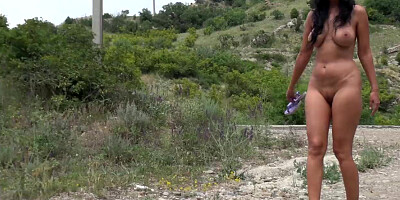 Nude on a mountain road