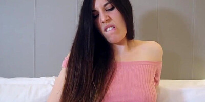 Enjoy the facial expressions of a busty brunette girl while she's masturbating