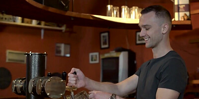 Tanned brunette sucks and rides old cock in empty bar