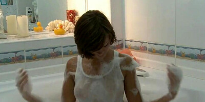 Lovely solo gal is gently rubbing her snatch while taking a bath