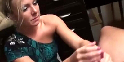 Amateur MILF grabs that hard cock and strokes it like a pro