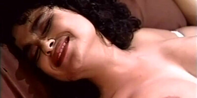 Vintage porn video shows a busty brunette riding hard cock