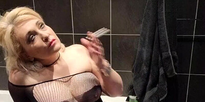 Chubby Mature Blonde Secretly Smoking in the bathroom with ashes on her big tits and pink pussy