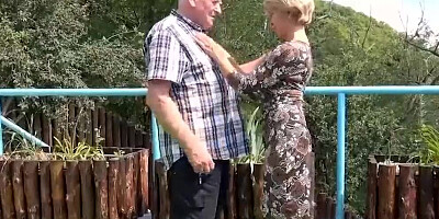 Two mature harlots are sucking and fucking the old man in an outdoor threesome