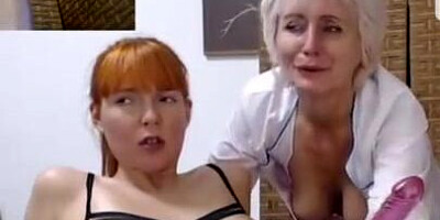 Horny grandma plays with redhead MILF's pussy on live webcam show