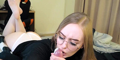 Nerdy girl is filmed POV-style while licking and sucking hard cock