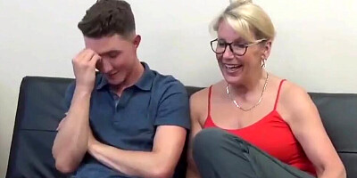 Busty blonde mom gives a nice handjob to her horny stepson