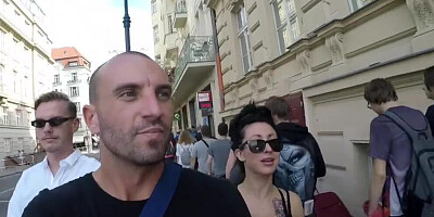 Tattooed and busty MILF pornstar talks kinky during a strolling interview outdoors
