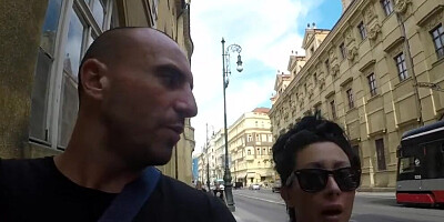 Tattooed and busty MILF pornstar talks kinky during a strolling interview outdoors