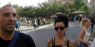 Tattooed and busty MILF pornstar talks kinky during a strolling interview outdoors