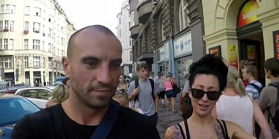 Tattooed and busty MILF pornstar talks kinky during a strolling interview outdoors