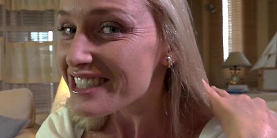 Blonde cougar teases in pantyhose and plays with her wet cunt