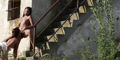Naughty lesbians are making out and licking by the abandoned building