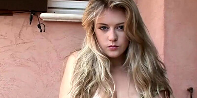 Cute blonde minx reveals her huge tits