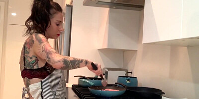 Solo tattooed hussy is wearing sexy lingerie while cooking and masturbating