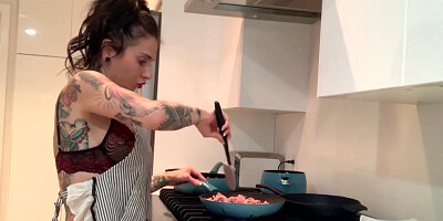 Solo tattooed hussy is wearing sexy lingerie while cooking and masturbating