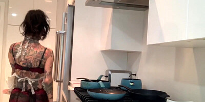 Solo tattooed hussy is wearing sexy lingerie while cooking and masturbating