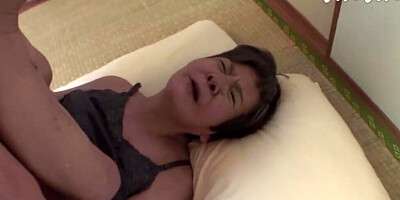 Old Asian woman is being fucked after giving that man a blowjob