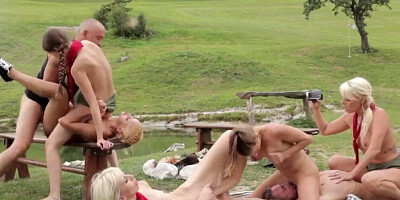 Naughty girls and their buddies are enjoying in hot outdoor orgy