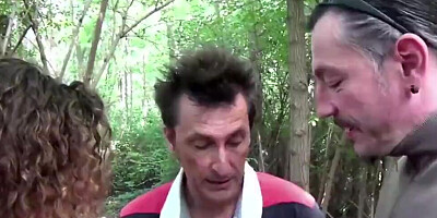 German MILF is poked in the woods with two hard peckers