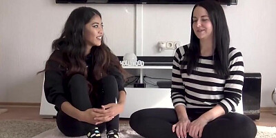 Two spicy brunettes are scissoring and licking their wet pussies