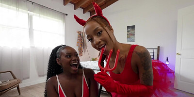 Two ebony chicks are cosplaying like slutty devils