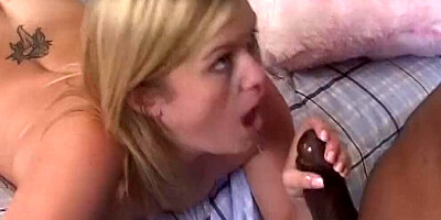 Blonde sucks a long black cock and takes it from behind
