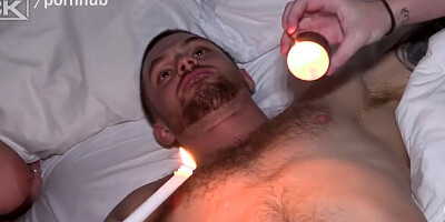 Endowed dude is restrained while having two kinky chicks playing with his prick