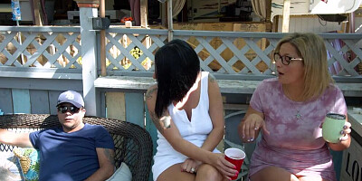 Three girls and one horny gardener are having sex in the open air