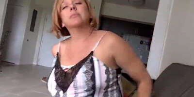 Full-bosomed blonde cougar is filmed while playing with stepson's cock