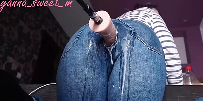 Fucking machine penetrates MILF's pussy thorough a hole on her jeans