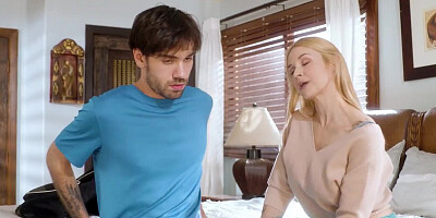 Inked blonde squeezes her tits while taking a big hard cock