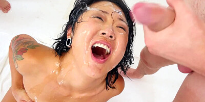 A cute Asian is with a group of men, sucking their large dicks