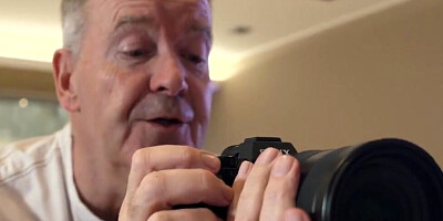 Grandad is taking pictures of two young babes before getting a blowjob from them