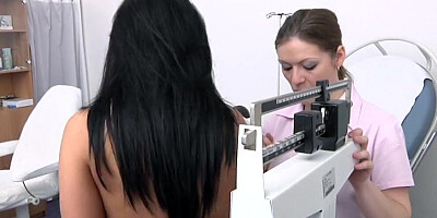 Elegant lady with big tits is getting a gyno exam from a young nurse