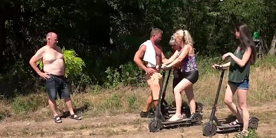 Slutty chicks and horny guys are having a sex orgy outside