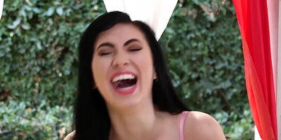 Charming brunette flirts with the camera while sucking a cock